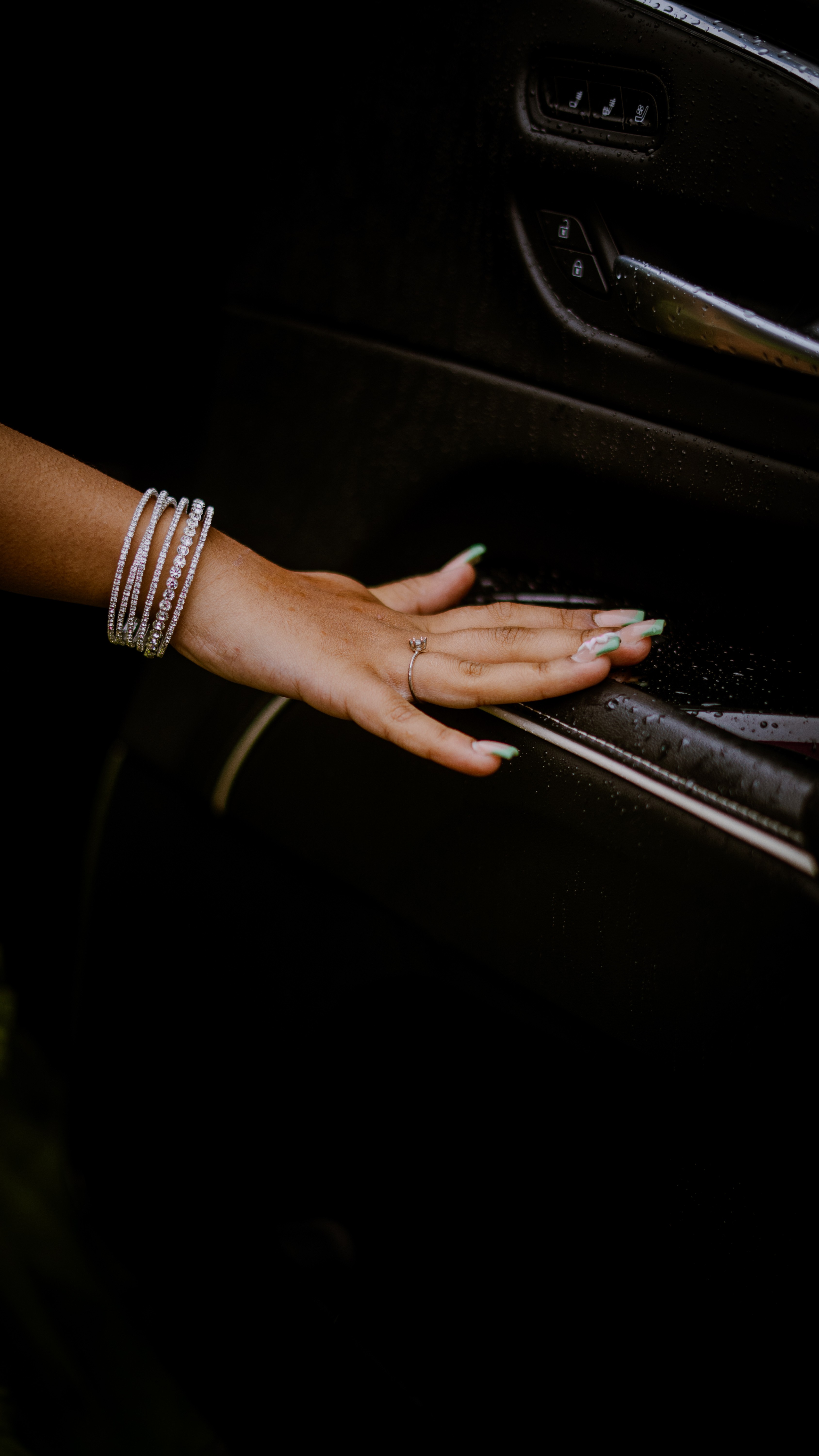 Close-up detail of graduate's jewelry and accessories