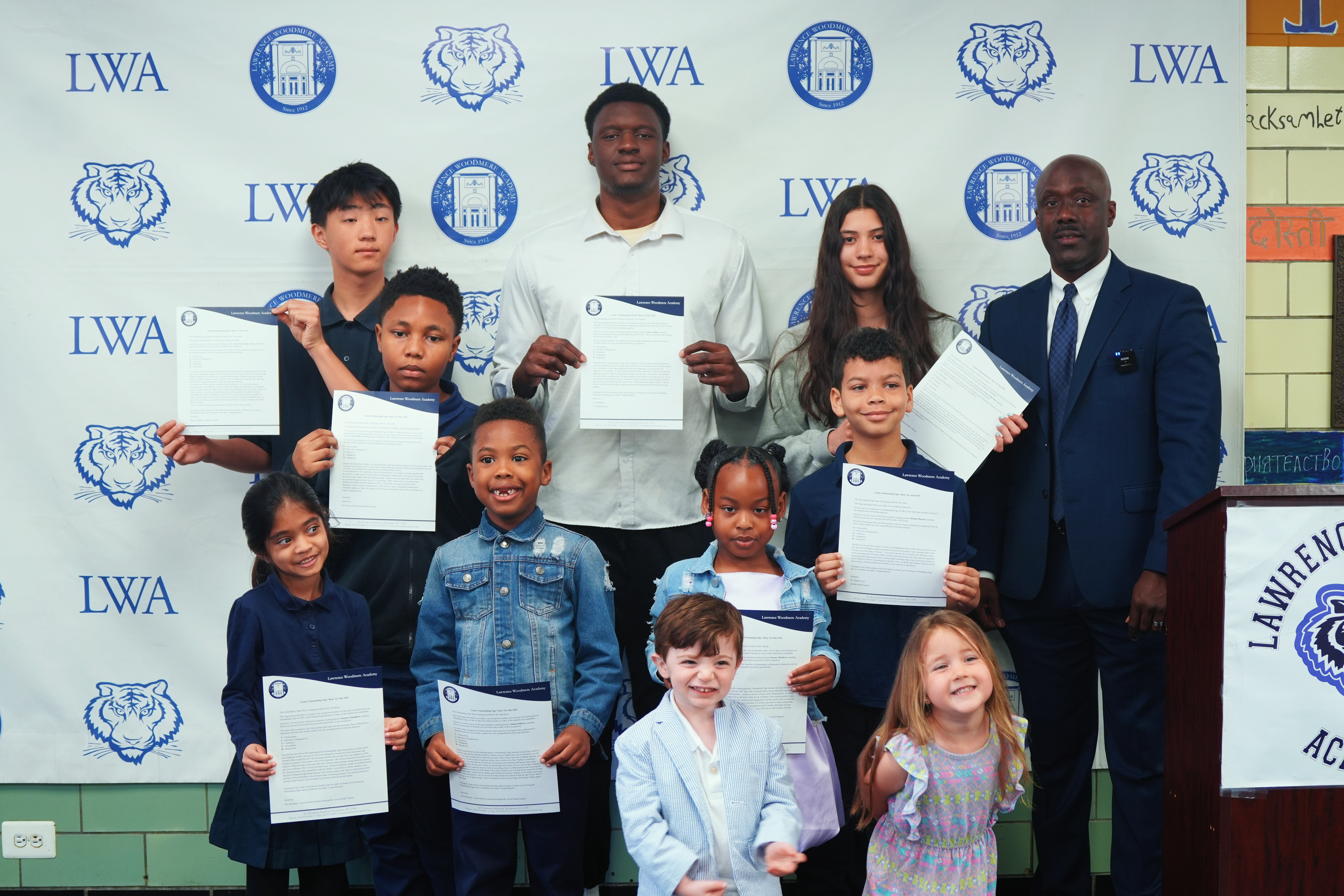 Graduation ceremony group photo with certificates